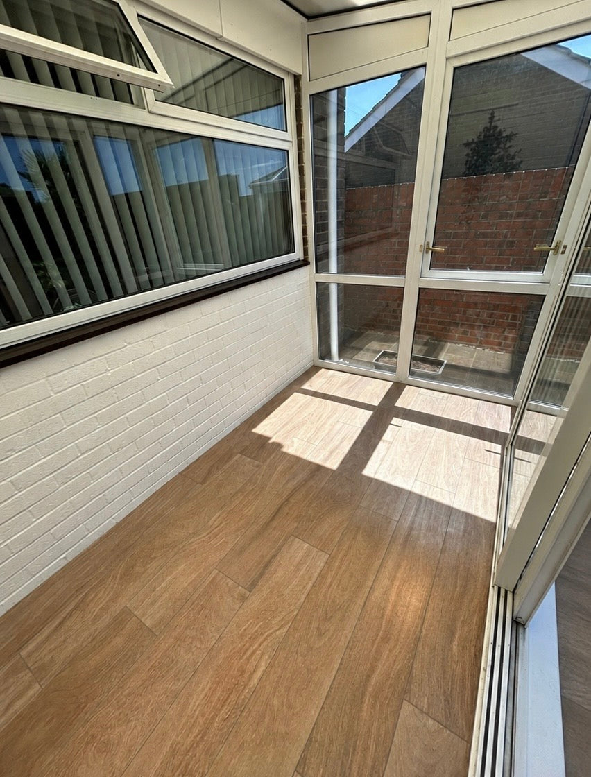 A tiled floor in wood planks