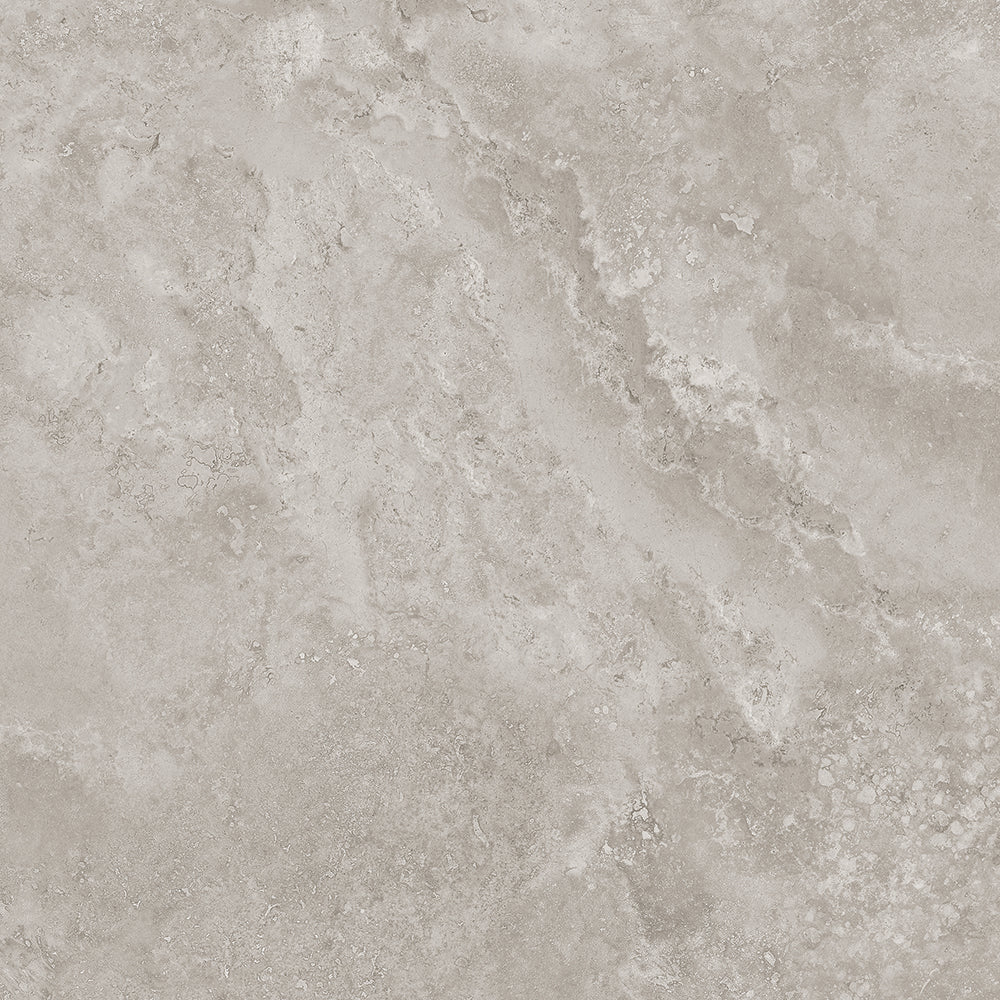 A close-up of a light warm gray stone effect porcelain tile with subtle mottled texture and natural tonal variation.