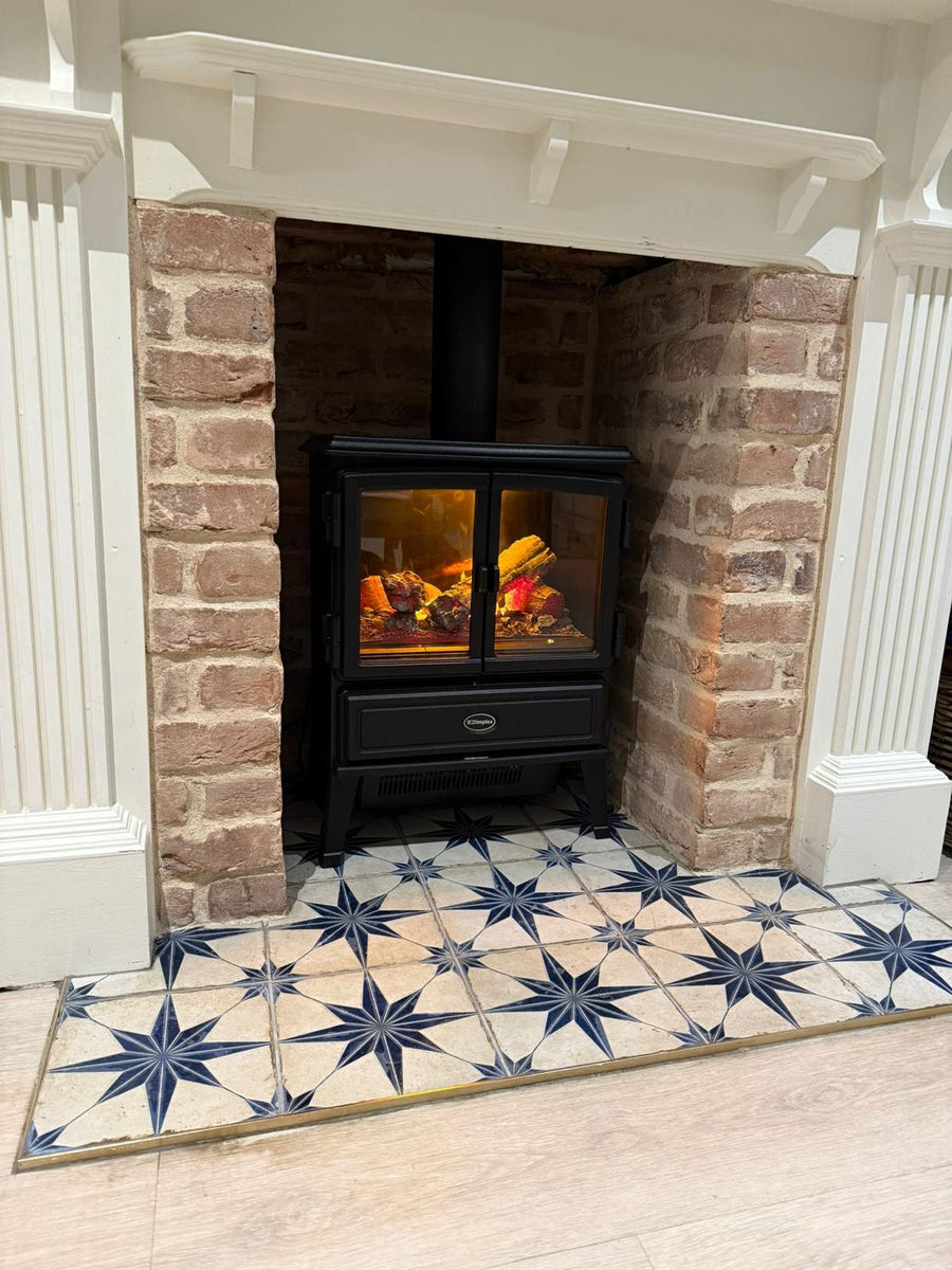 Blue star tiles on the hearth of the fireplace